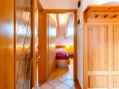 a hallway with a door leading to a bedroom at Apartment Cesa Pra da Molin-4 by Interhome in Campitello