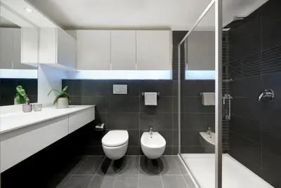 a bathroom with a toilet and a sink and a shower at Franciscus Apartments in Bolzano