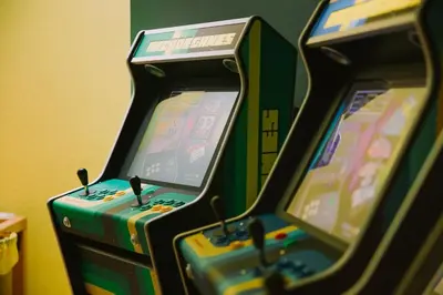 two video game machines sitting next to each other at Botango in Parcines