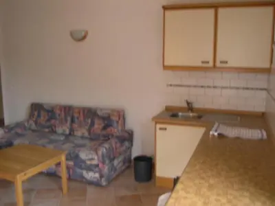 a living room with a couch and a table at Fewo Dreiraum im Haus Götsch 3 in Parcines