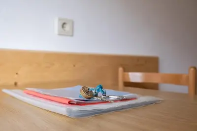 a pair of tongs and a pair of scissors on a table at Fewo Dreiraum im Haus Götsch 2 in Parcines