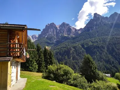 a house on a hill with mountains in the background at The 