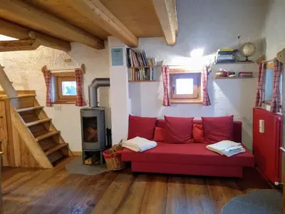 a small kitchen with a sink and a stove at The 