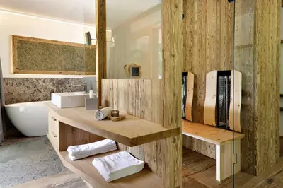a bathroom with a sink and a bath tub at Hotel Ratschingserhof in Racines