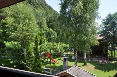 a view of a yard with a playground at Burgfrieden in Vipiteno