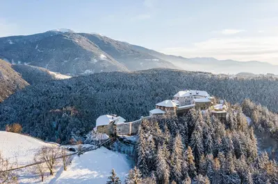 a house on top of a mountain in the snow at Pension Volgger in Rodengo