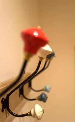 a close up of a lamp with a red hat at App110 in Merano