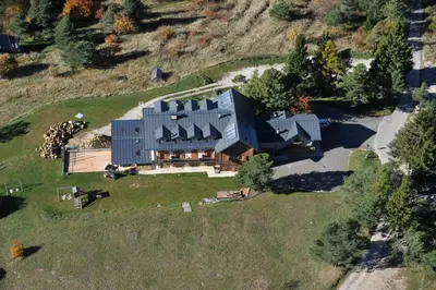 an overhead view of a large house on a hill at Rifugio Predaia Ai Todes'ci in Tres
