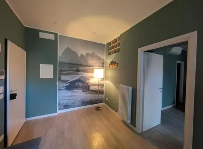 a room with a hallway with a painting on the wall at Casa al Duomo - Domhaus in Bolzano