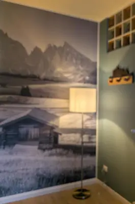 a lamp in a room with a painting on the wall at Casa al Duomo - Domhaus in Bolzano