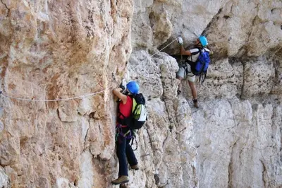 two people climbing on a rock wall at Hotel Garni Civetta in Selva di Cadore