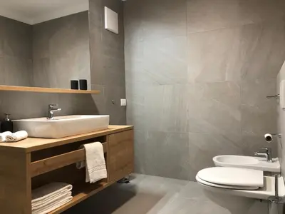a bathroom with a sink and a toilet at Apartment42 in Bressanone