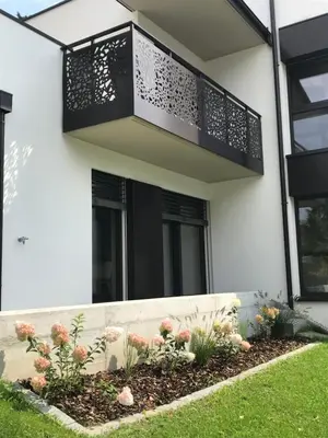 a flower bed in front of a house at Apartment42 in Bressanone