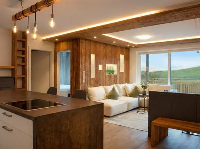 a kitchen and living room with a couch and a table at Panorama Residence Saltauserhof Resort in Saltusio