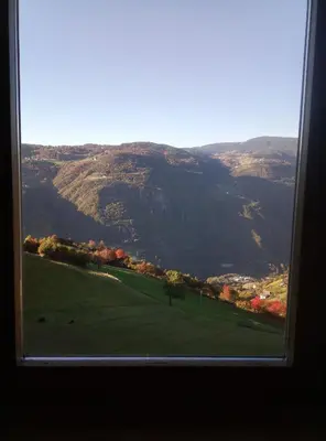 a view of a mountain from a window at Pension Fellis in Vols am Schlern