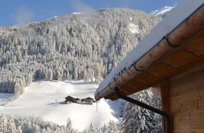 a view from a window of a house in the snow at Bergidyll an der Lane - Pfunders in Fundres