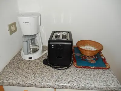 a counter with a coffee maker and a blender on it at Garni Sonnleiten in Tirolo
