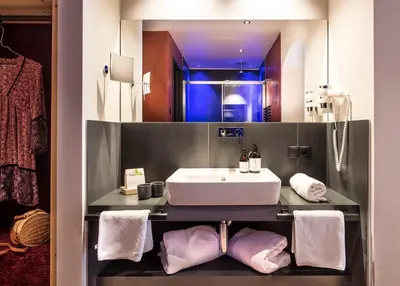 a bathroom with a sink and a mirror at Hotel Paradies in Tires