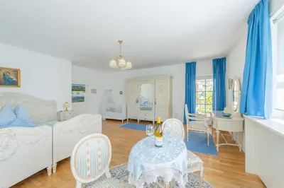 a living room with a couch and a table at Haus Bellutti in Termeno