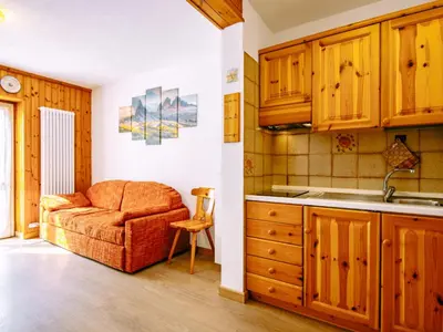 a snowy road with a mountain in the background at Apartment Ciampac by Interhome in Alba di Canazei