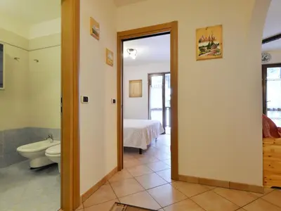 a kitchen and a bedroom with a bed and a sink at Apartment Condominio al Parco-4 by Interhome in Canazei