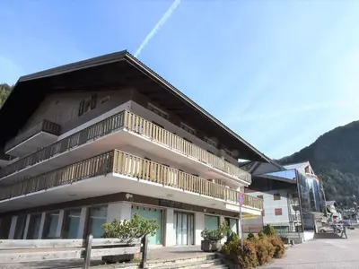 a building with a balcony on the side of it at Apartment Condominio al Parco-5 by Interhome in Canazei