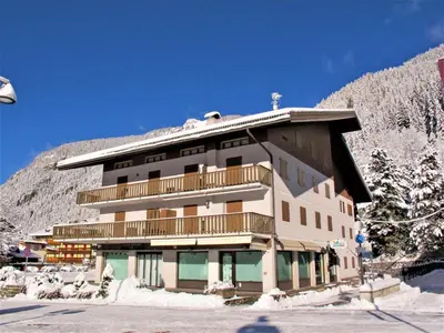 a building with a balcony on the side of it at Apartment Condominio al Parco-2 by Interhome in Canazei