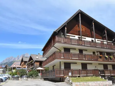 a large building with snow on the roof at Apartment Apt 47 by Interhome in Alba di Canazei