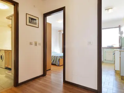 a large mirror in a room with a bedroom at Apartment Condominio al Parco-1 by Interhome in Canazei