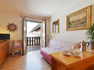 a living room with a couch and a table at Apartment Condominio al Parco-1 by Interhome in Canazei