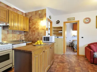 a kitchen with a bowl of fruit on the counter at Apartment Cesa Fraines-3 by Interhome in Alba di Canazei