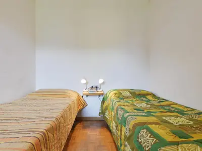 two beds sitting next to each other in a room at Apartment Cesa Palua by Interhome in Alba di Canazei