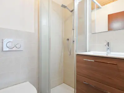 a building with a balcony with mountains in the background at Apartment Apt 39 by Interhome in Alba di Canazei