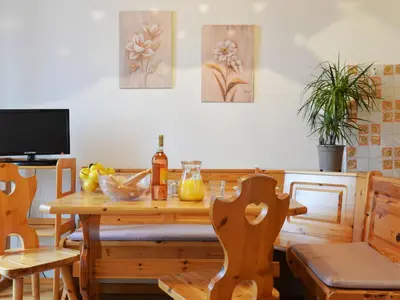 a dining room with a wooden table and chairs at Apartment Apt 39 by Interhome in Alba di Canazei