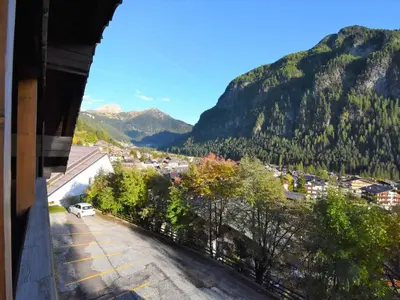 a view of a city and mountains from a balcony at Apartment Villa Bellavista by Interhome in Campitello di Fassa