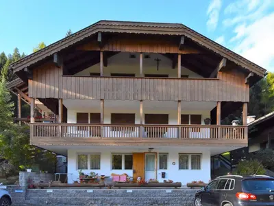a large house with a wrap around deck at Apartment Villa Bellavista by Interhome in Campitello di Fassa