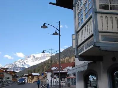 a view from a balcony of a town with a parking lot at Apartment Villa Placidia Apt 22 by Interhome in Campitello di Fassa
