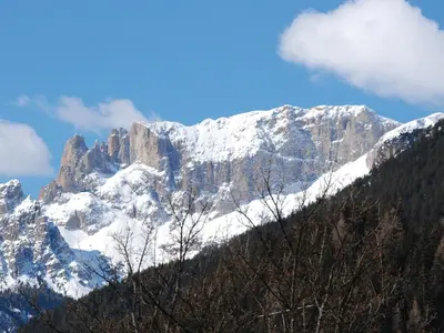 a large white building with snow on the roof at Apartment Villa Placidia Apt 22 by Interhome in Campitello di Fassa