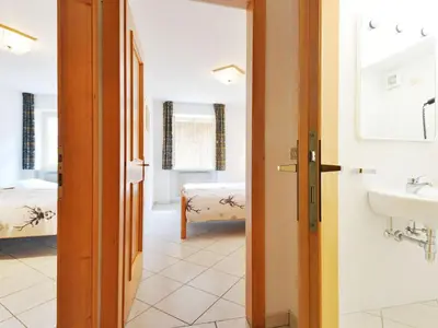 a bathroom with a sink and a mirror at Apartment Villa Placidia Apt 21 by Interhome in Campitello di Fassa