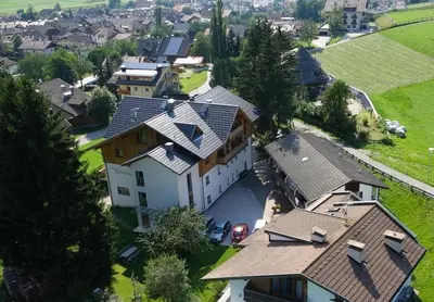 an overhead view of a large house with roofs at Appartments Helvetia in Villabassa