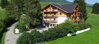 an aerial view of a large house in a field at Appartments Helvetia in Villabassa