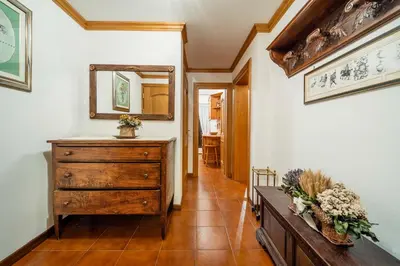 a hallway with a dresser and a mirror at Villa Radiosa - Stayincortina in Cortina dʼAmpezzo