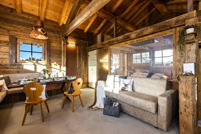 a living room with a couch and a table at Luxury Wellness Lusiaski in Bellamonte