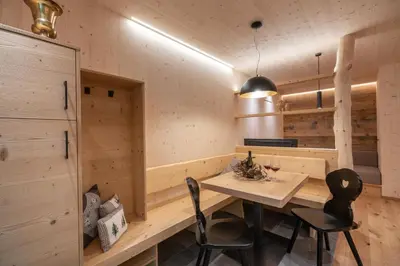 a dining room with a table and two chairs at Unterhuberhof in Albes