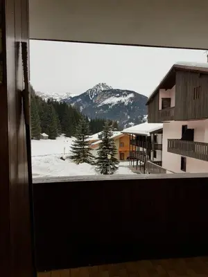 a view of a snow covered mountain from a window at Des Alpes 1 in Canazei