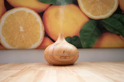 a wooden bowl sitting on a table in front of a pile of fruit at White Tower of Love in Bressanone