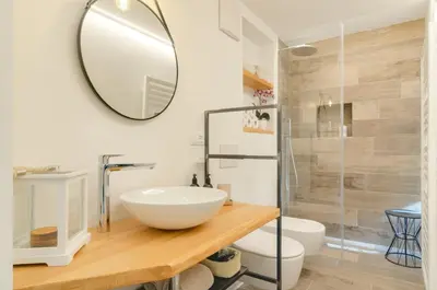 a bathroom with a sink and a mirror at Vinci16 in Bolzano