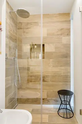 a bathroom with a shower with a glass door at Vinci16 in Bolzano