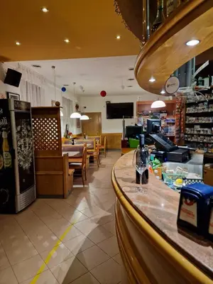 a bar in a store with a counter and a restaurant at B&B SEGONZANO in Segonzano