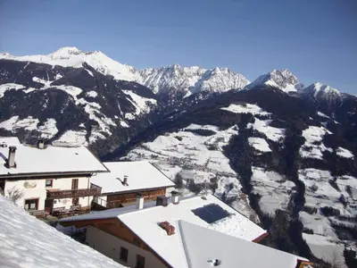 a view of a mountain with snow covered mountains at Unterthurnerhof in Rifiano